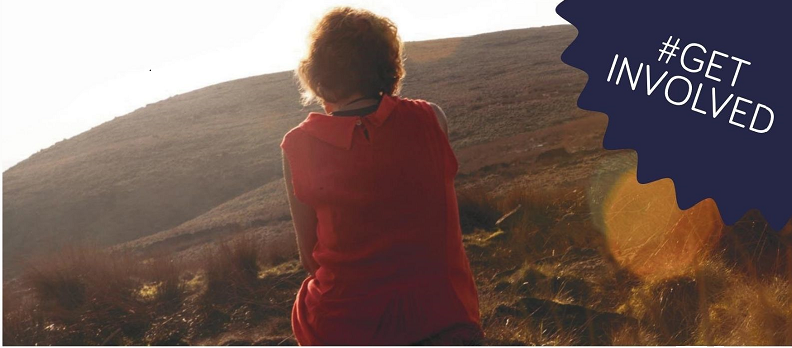 Lady sat on a hill