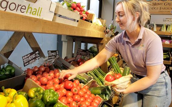 Fresh and Fruity trader sorting fruit and vegetables