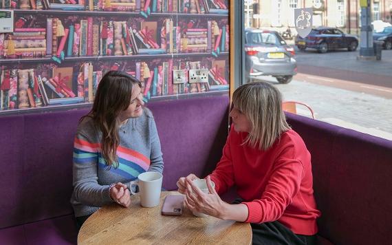 Customers socialising over a drink at Cherry Pie