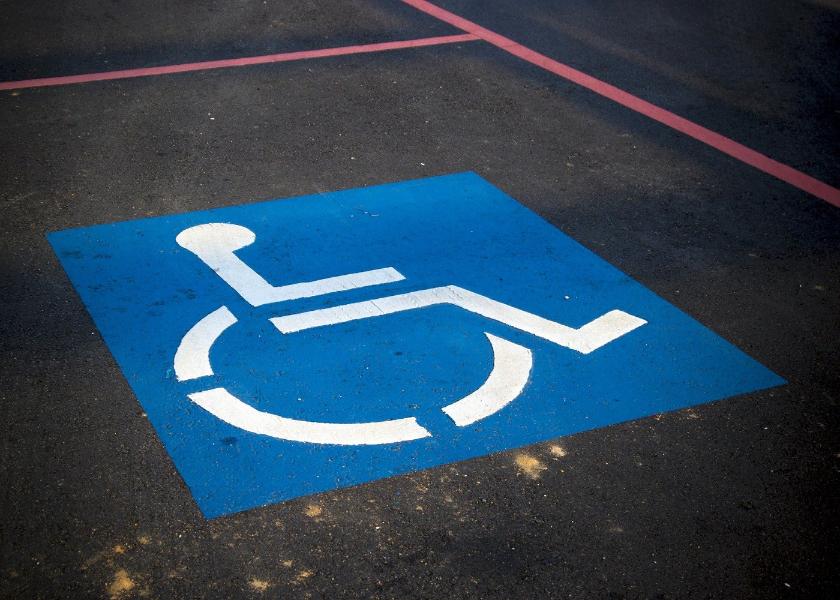 Disabled car parking sign and space